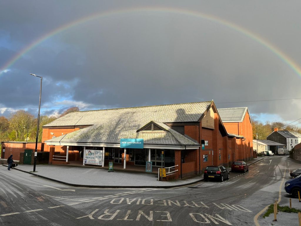 New Life Church with a rainbow overhead